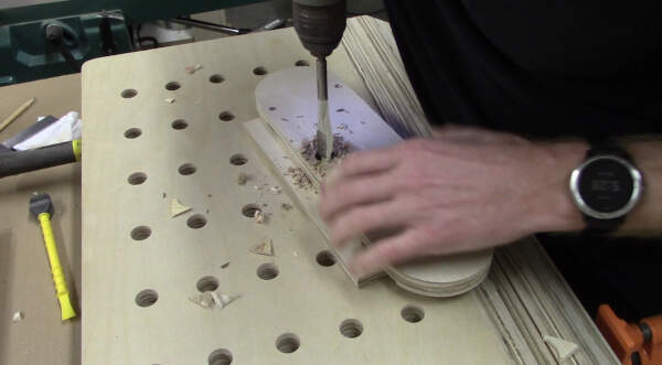 drill a finger hole in the table saw insert