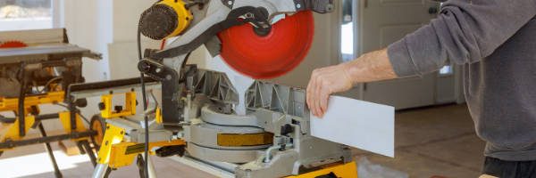 miter saw being used in woodworking