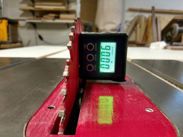 digital level used to align the table saw blade for panel glue ups