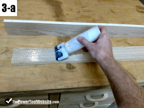 applying glue to make the fence for the table saw sled